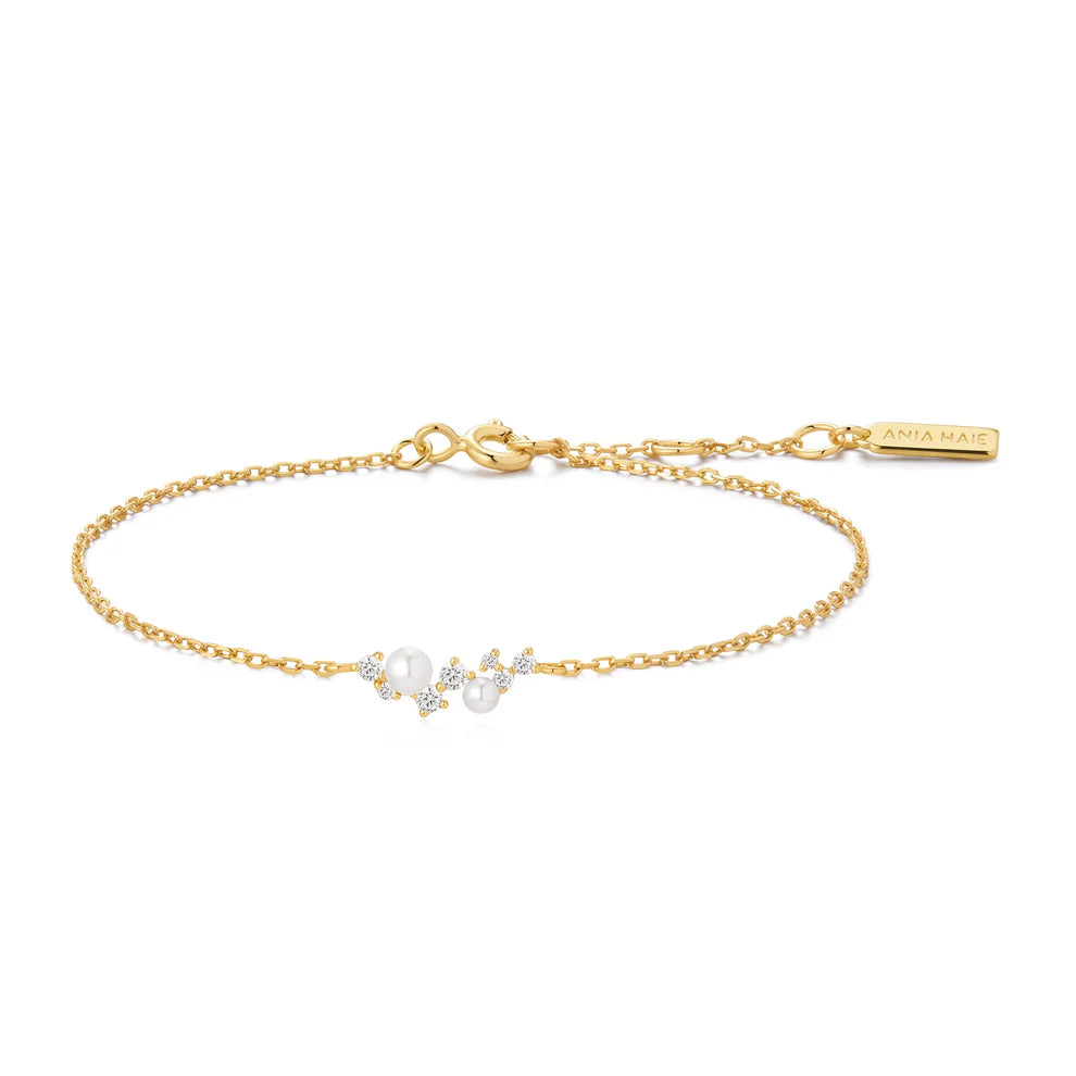 Polsera d'or amb petxines i perles