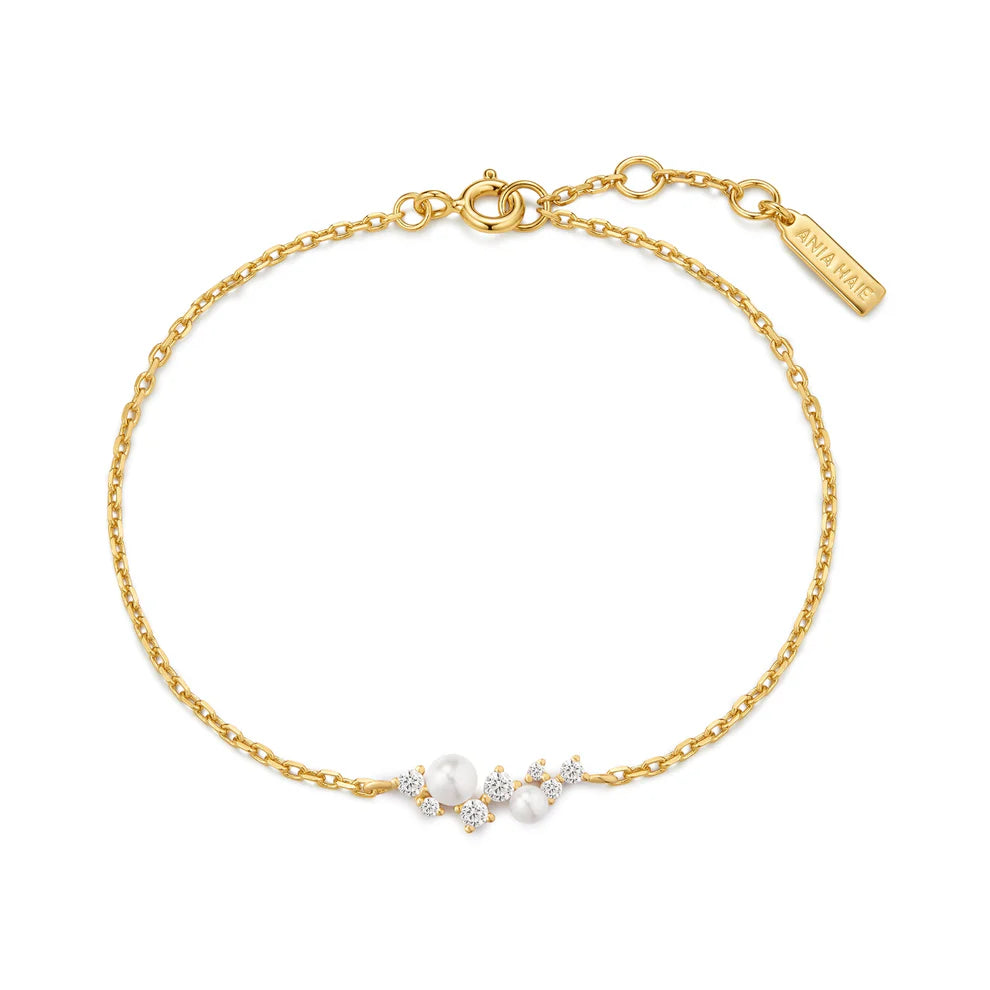 Polsera d'or amb petxines i perles